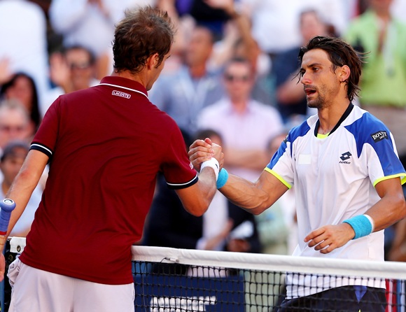 Richard Gasquet of France shakes hands at the net with David Ferrer of Spain