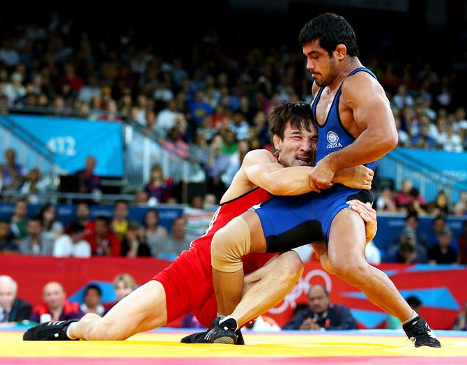 Sushil Kumar of India in action against Akzhurek Tanatarov of Kazakhstan during the men's freestyle wrestling 66kg semi-final bout at the London 2012 Olympic Games
