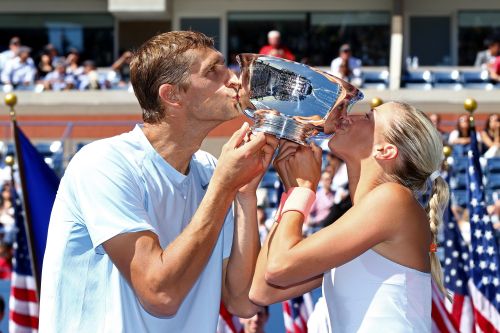 Max Mirnyi of Belarus and Andrea Hlavackova of Czech Republic kiss the trophy after winning their mixed doubles final match against Abigail Spears of the United States of America and Santiago Gonzalez of Mexico