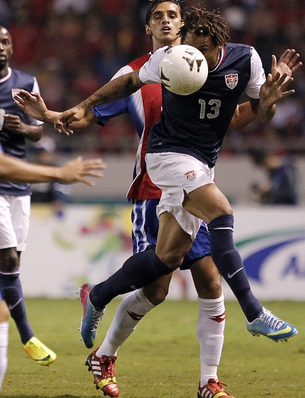 Jermaine Jones (front) of the US heads the ball against Costa Rica's Bryan Ruiz
