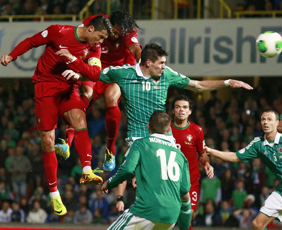 Portugal's Cristiano Ronaldo (left) heads a goal against Northern Ireland