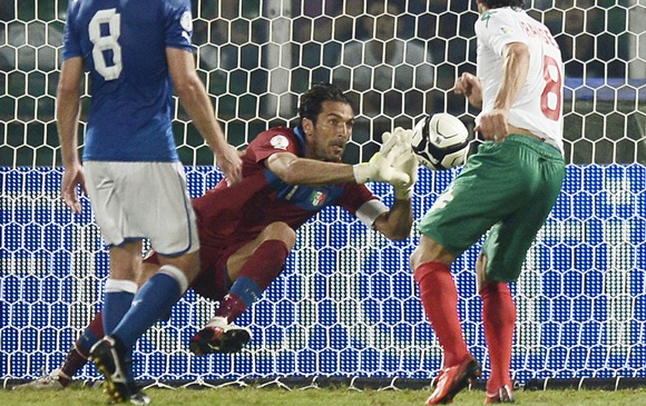Italy's goalkeeper Gianluigi Buffon (centre) makes a save 