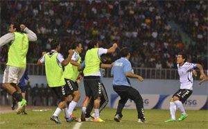 Afghan players celebrate after winning the match against Nepal on Sunday