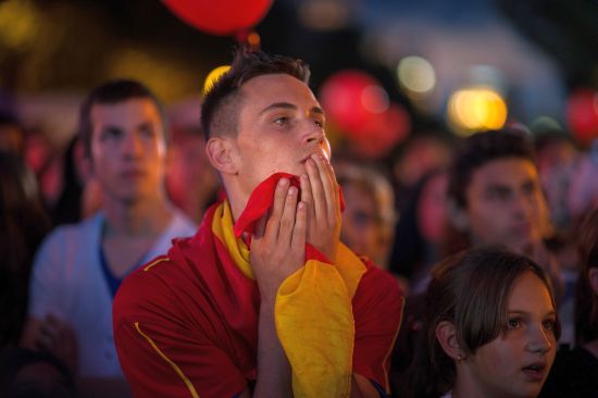 A young man reacts after Madrid was eliminated from the 2020 Olympic Candidacy decision
