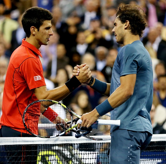 Rafael Nadal of Spain shakes hands at the net with Novak Djokovic of Serbia