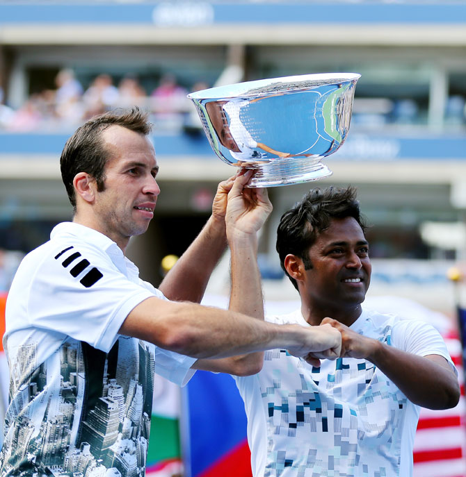Leander Paes (right) and Radek Stepanek pose with the US Open trophy after winning the men's doubles final against Alexander Peya of Austria and Bruno Soares of Brazil