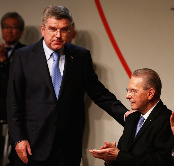 Thomas Bach thanks President of the IOC Jacques Rogge as he is announced as the ninth IOC President