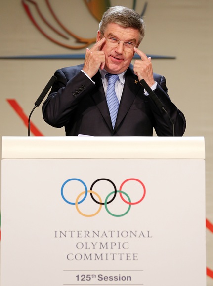 Thomas Bach reacts as he is announced as the ninth IOC President