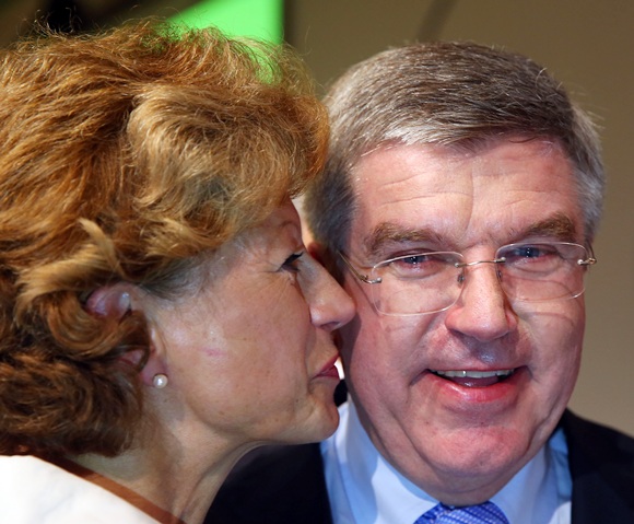 Newly announced ninth IOC President Thomas Bach is congratulated by wife Claudia
