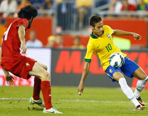 Neymar of Brazil traps the ball against Portugal