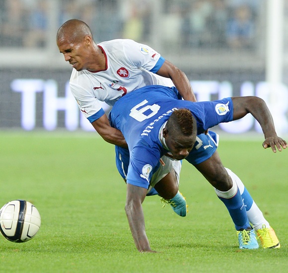 Mario Balotelli of Italy (9) and Theodor Gebreselassie of Czech Republic compete for the ball