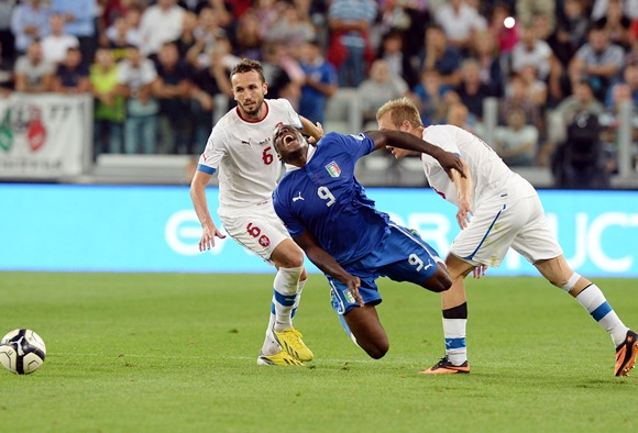 Mario Balotelli of Italy (9) and Daniel Kolar of Czech Republic (right) compete for the ball