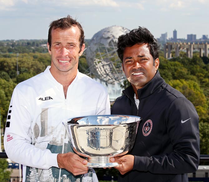 Leander Paes (right) and Radek Stepanek pose with the US Open men's double trophy