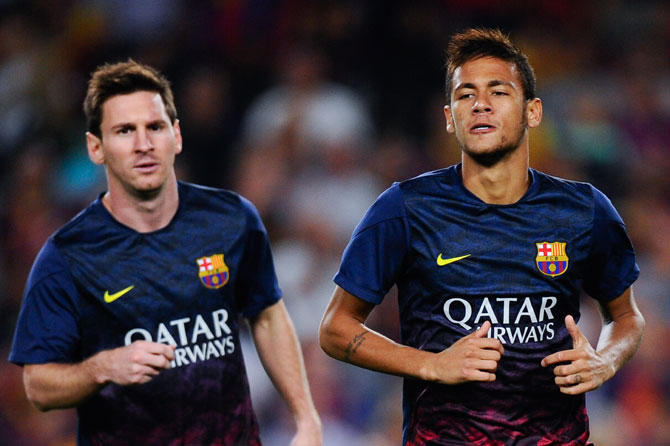 Lionel Messi of FC Barcelona and his team-mate Neymar during the warm up