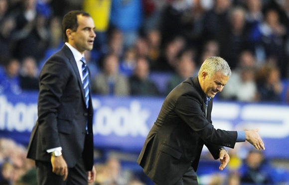 Chelsea Manager Jose Mourinho and Everton Manager Roberto Martinez (left) react