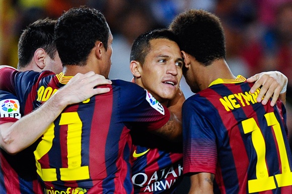 Alexis Sanchez of FC Barcelona (centre) celebrates with his teammates
