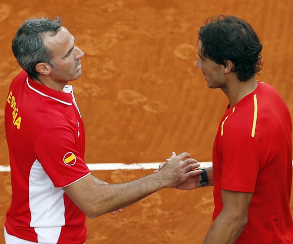 Spain's Rafael Nadal (right) is congratulated by team captain Alex Corretja