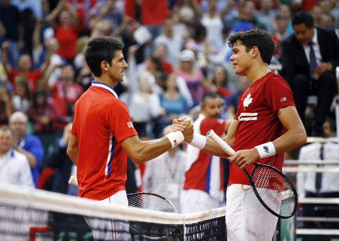 Serbia's Novak Djokovic (left) shakes hands with Canada's Milos Raonic after their Davis Cup semi-final