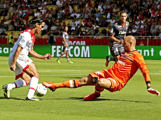 Radamel Falcao tries to get the ball past FC Lorient's goalkeeper Fabien Audard