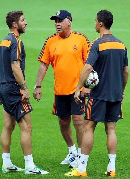 Real Madrid's coach Carlo Ancelotti, Sergio Ramos and Christiano Ronaldo attend a training session