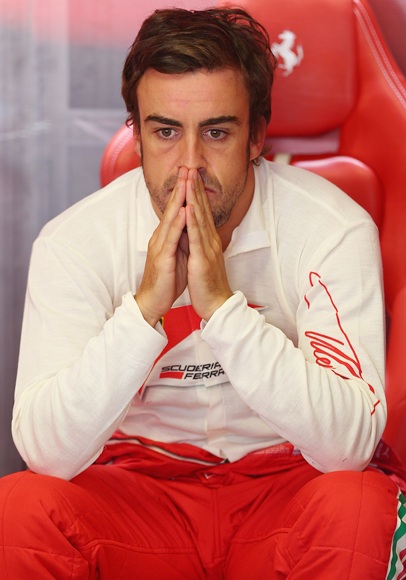 Fernando Alonso of Spain and Ferrari prepares to drive