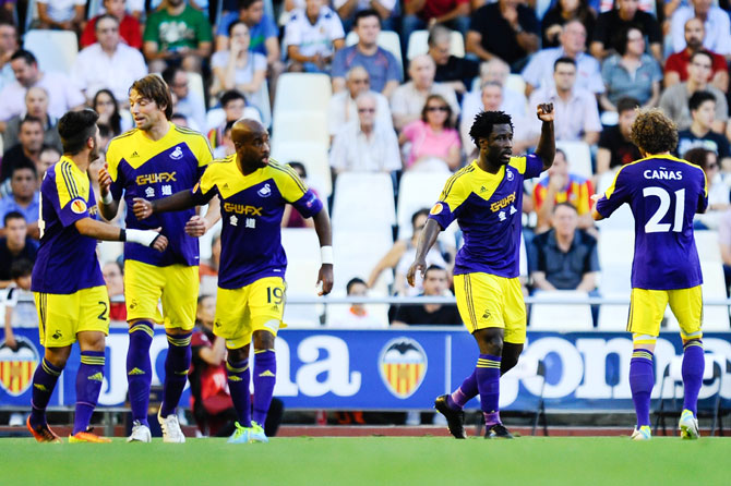 Wilfried Bony of Swansea City (second right) celebrates after scoring the opening goal