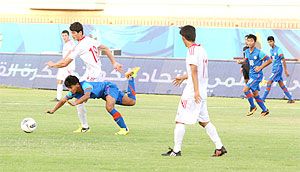 Anirudh Thapa is brought down by Tajikistan's Muhammad Hasan in the AFC U-16 Qualifiers
