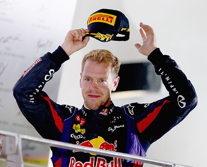Sebastian Vettel of Germany and Infiniti Red Bull racing celebrates following his victory during the Singapore Formula One Grand Prix