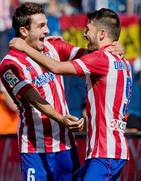 David Villa (right) of Atletico de Madrid celebrates scoring their opening goal with team-mate Koke