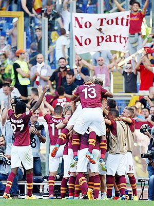 AS Roma players celebrate the team's second goal scored by Adem Ljaijc during the Serie A match against SS Lazio