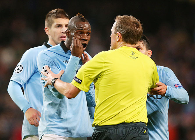 Mario Balotelli argues with referee Peter Rasmussen after being denied a penalty during Manchester City's UEFA Champions League Group D match against Ajax Amsterdam in November 2012