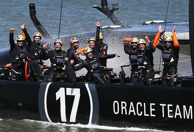 Oracle Team USA skippered by James Spithill celebrates after they beat Emirates Team New Zealand to defend the America's Cup during the final race on in San Francisco, California