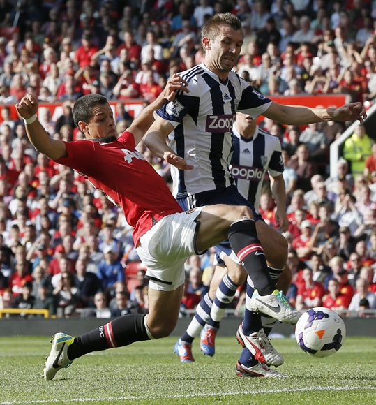 Manchester United's Javier Hernandez (left) challenges West Bromwich Albion's Gareth McAuley