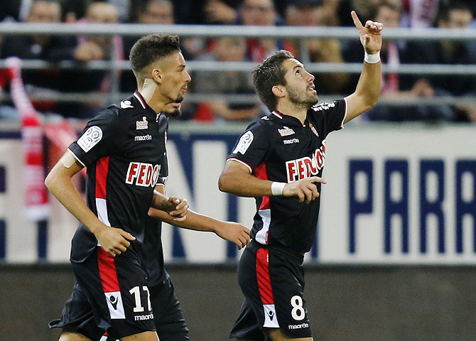 AS Monaco's Joao Moutinho (right) celebrates his goal against Reims during their French Ligue 1 match at Auguste Delaune Stadium in Reims on Sunday