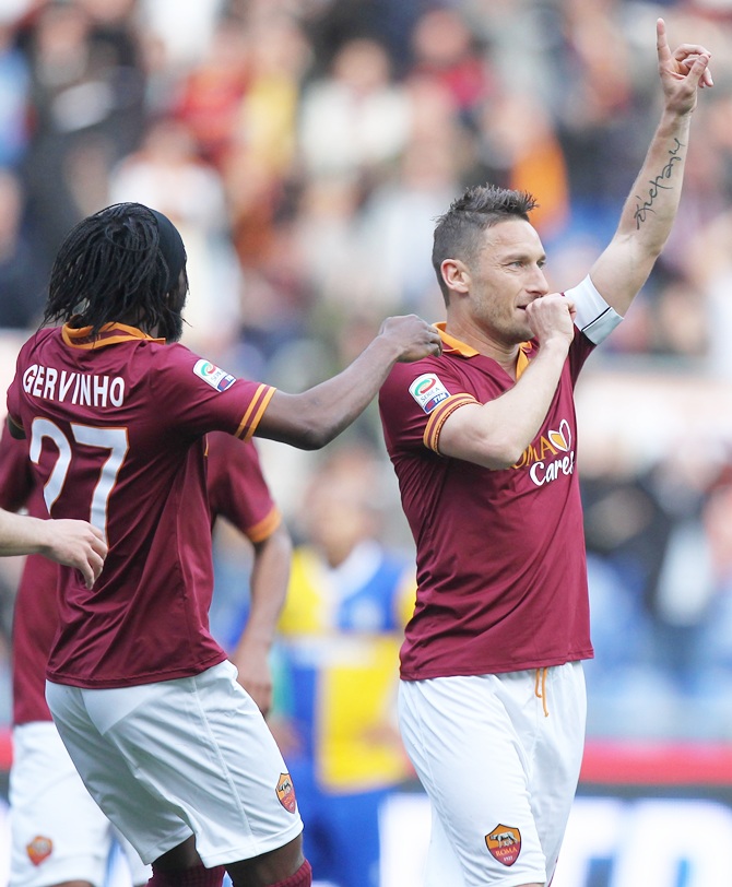 Francesco Totti of AS Roma celebrates after scoring the second team's goal during the Serie A match against FC Parma