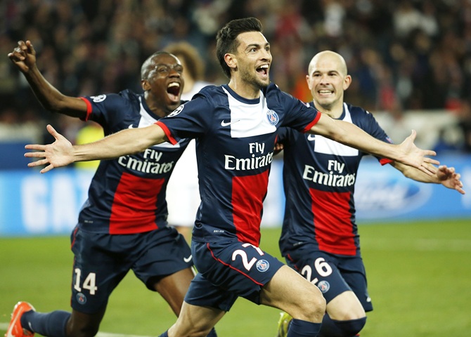 Paris St Germain's Javier Patore, centre, celebrates with teammates after scoring the third goal