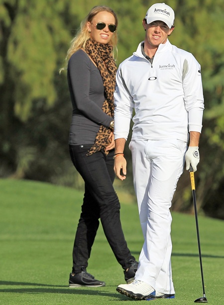 Rory McIlroy of Northern Ireland with his fiancee Caroline Wozniacki