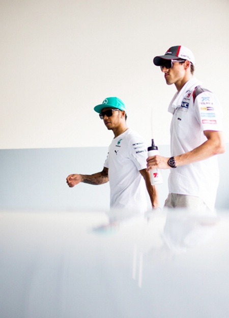 Lewis Hamilton of Great Britain and Mercedes GP Petronas,left, and Adrian Sutil of Germany and Sauber