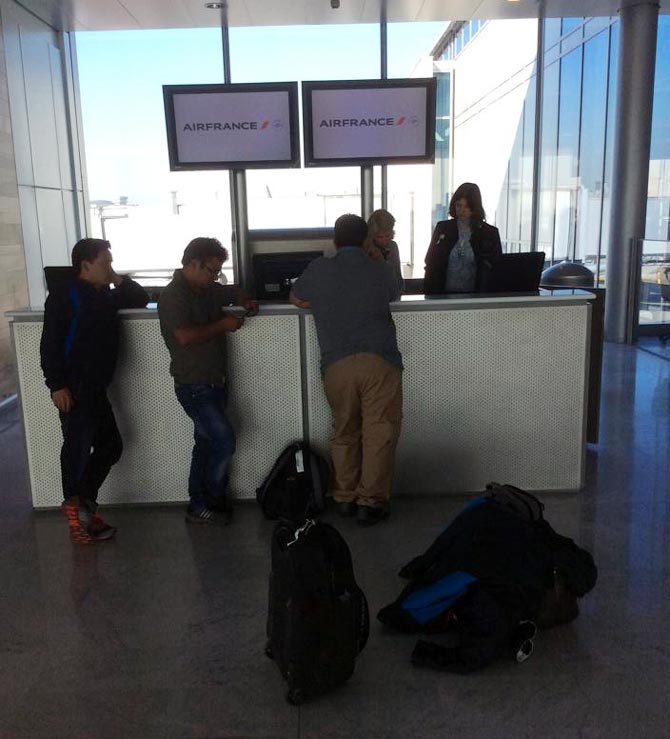 Indian shooters speak to Air France officials at Paris International Airport