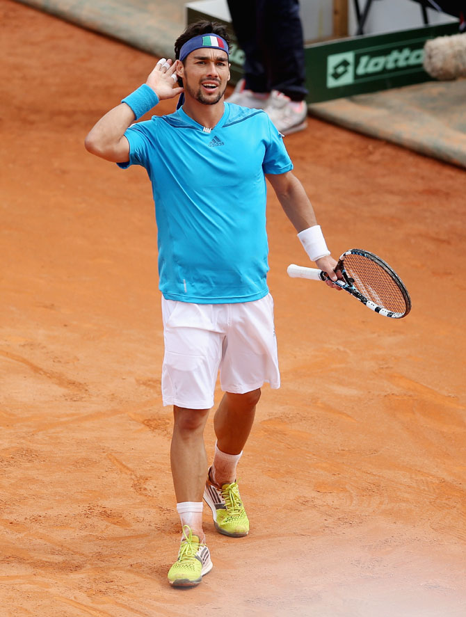 Fabio Fognini of Italy celebrates match point after his straight sets victory over Andy Murray of Great Britain during their Davis Cup World Group quarter-final at Tennis Club Napoli in Naples, Italy on Sunday