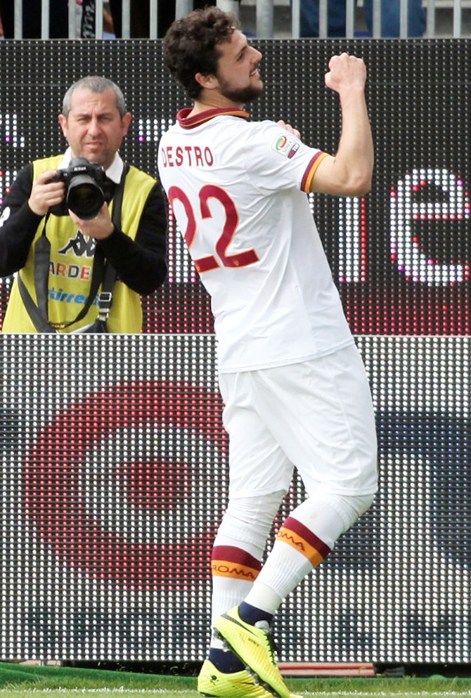 Mattia Destro,centre, of Roma celebrates after scoring their third goal and completing a hat-trick