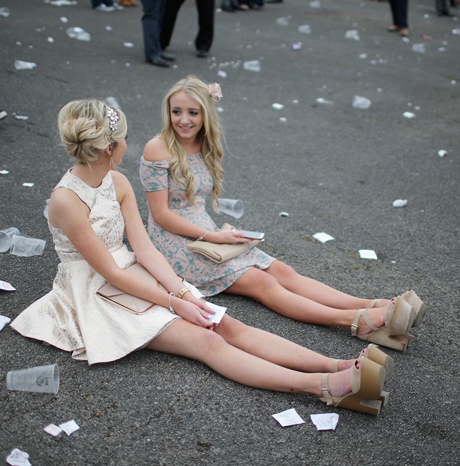 Racegoers relax as they enjoy the atmosphere of Ladies Day