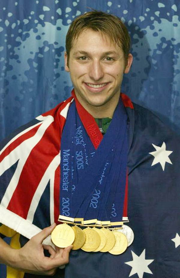 Ian Thorpe poses with the six gold medals and one silver medal he won during the 2002 Commonwealth Games, Manchester, England on August 5, 2002.
