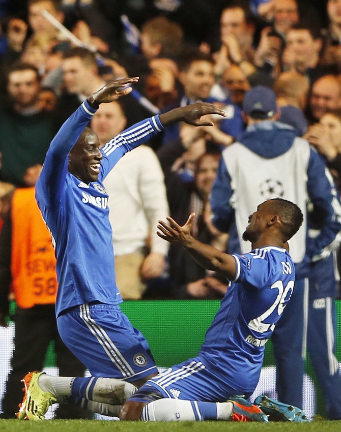 Chelsea's Demba Ba,left, who scored the second goal for the team, celebrates with team mate Samuel Eto'o
