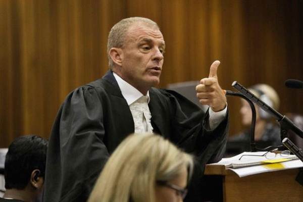 State prosecutor Gerrie Nel gestures as he cross examines Oscar Pistorius