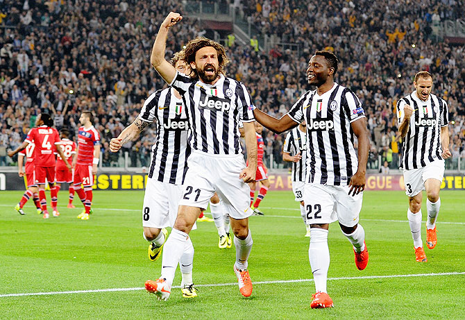 Andrea Pirlo of Juventus #21 celebrates scoring against Olympique Lyon at Juventus Arena on Thursday