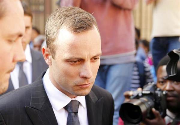 Olympic and Paralympic track star Oscar Pistorius reacts after the day's proceedings at the North Gauteng high court in Pretoria