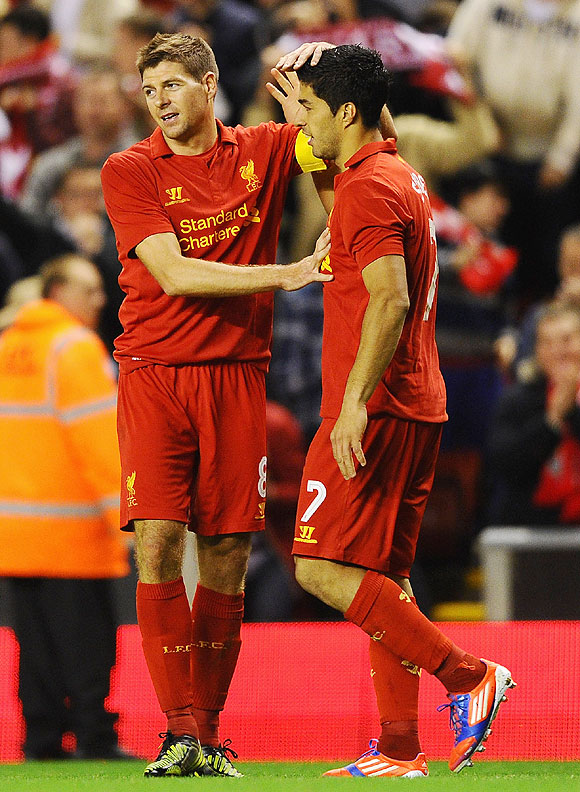 Liverpool's Steven Gerrard and teammate Luis Suarez