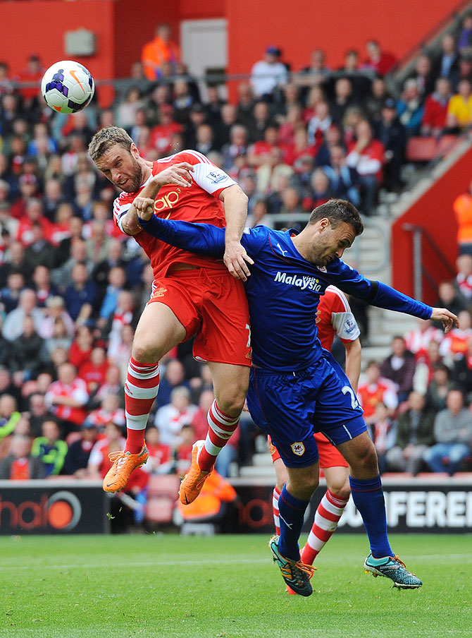 Rickie Lambert of Southampton rises above Juan Cala of Cardiff to direct a header on goal at St Mary's Stadium in Southampton on Sunday