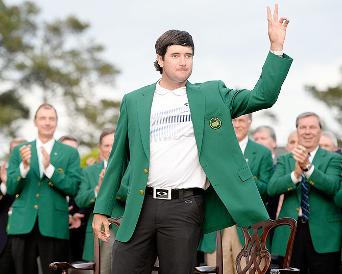 Bubba Watson of the United States poses with the green jacket after winning the 2014 Masters Tournament by a three-stroke margin at the Augusta National Golf Club in Augusta, Georgia on Sunday